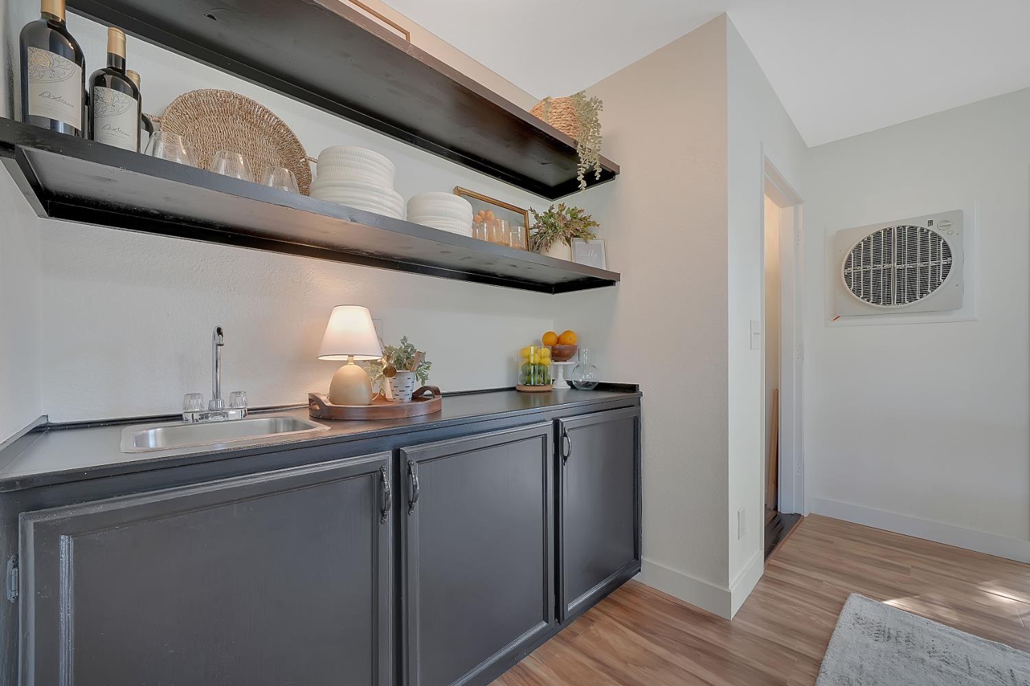 513 Perry Street Jackson, CA 95642 - Photo 12 of 56 a kitchen with stainless steel appliances granite countertop a sink and wooden cabinets