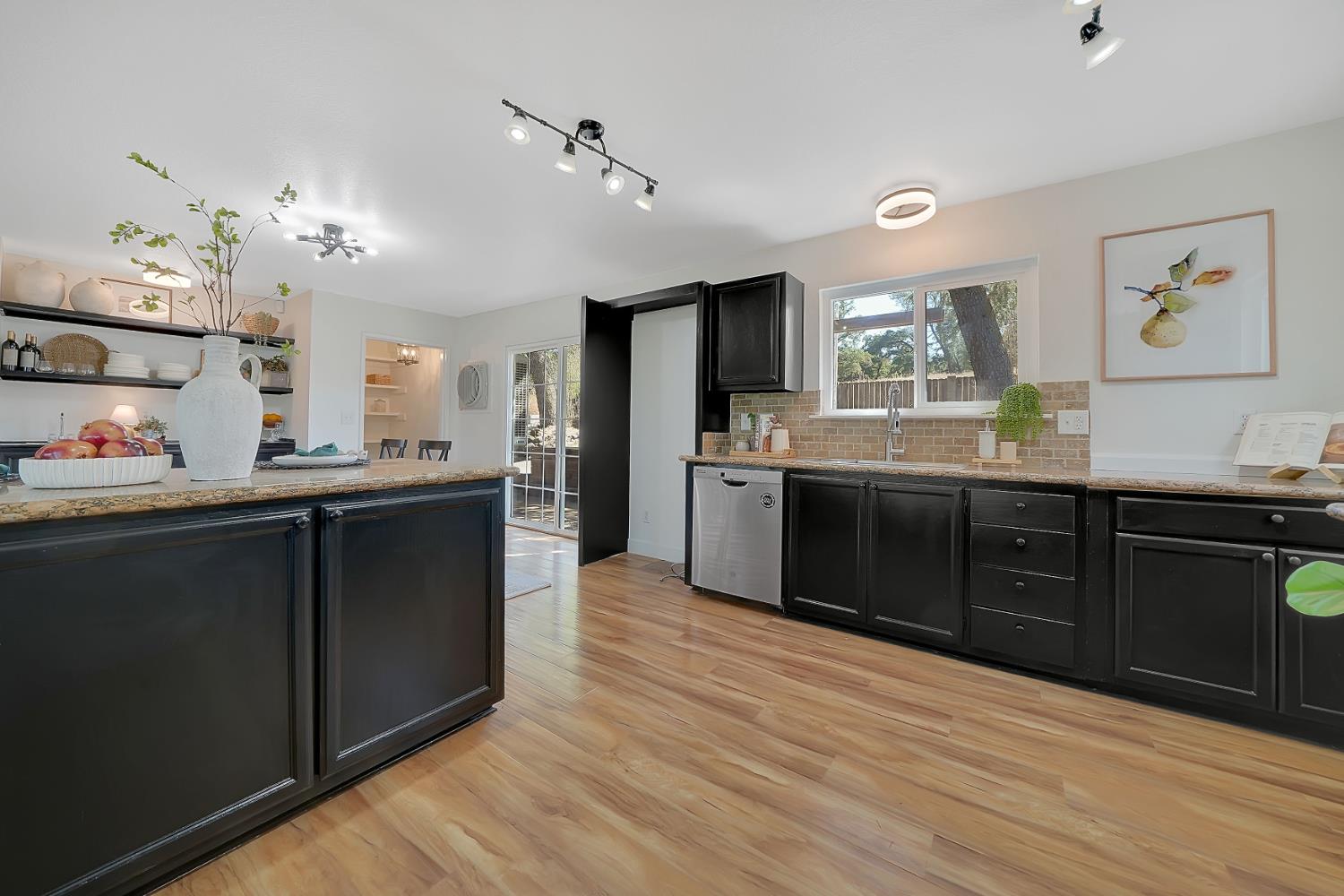 513 Perry Street Jackson, CA 95642 - Photo 18 of 56 a kitchen with stainless steel appliances granite countertop a sink cabinets and wooden floor