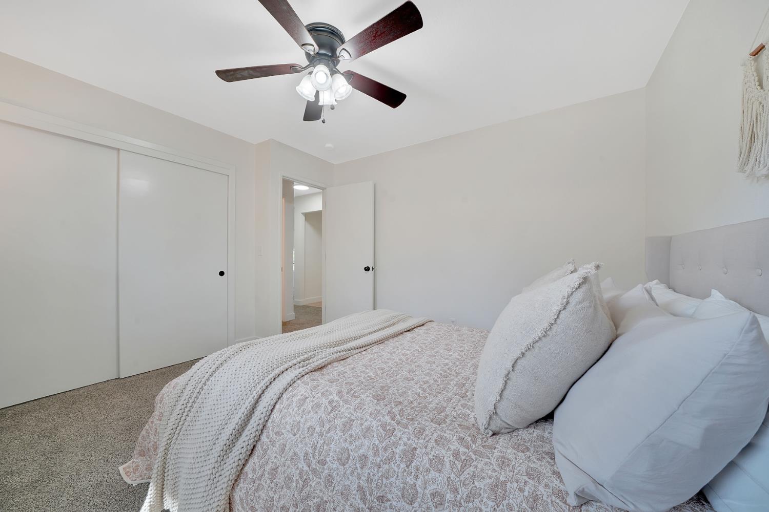 513 Perry Street Jackson, CA 95642 - Photo 39 of 56 a view of a bedroom with a bed and a ceiling fan