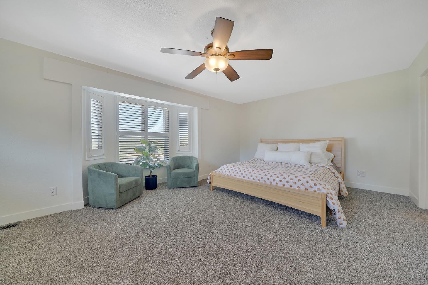 513 Perry Street Jackson, CA 95642 - Photo 40 of 56 a bedroom with furniture and a large window