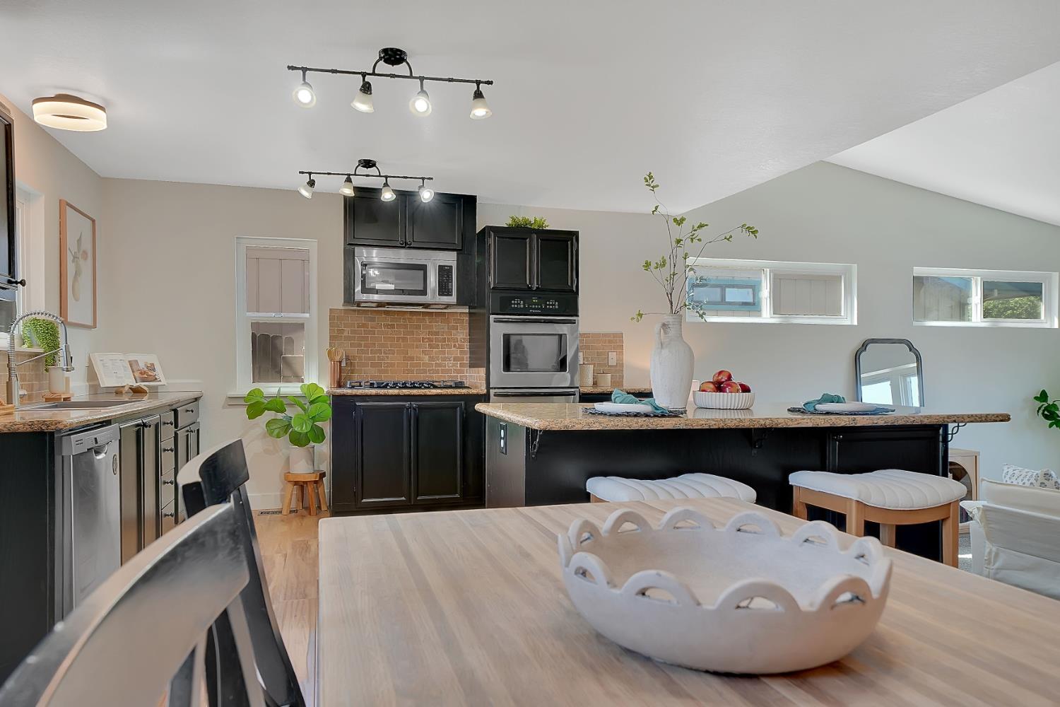 513 Perry Street Jackson, CA 95642 - Photo 4 of 56 a kitchen with a cabinets and appliances