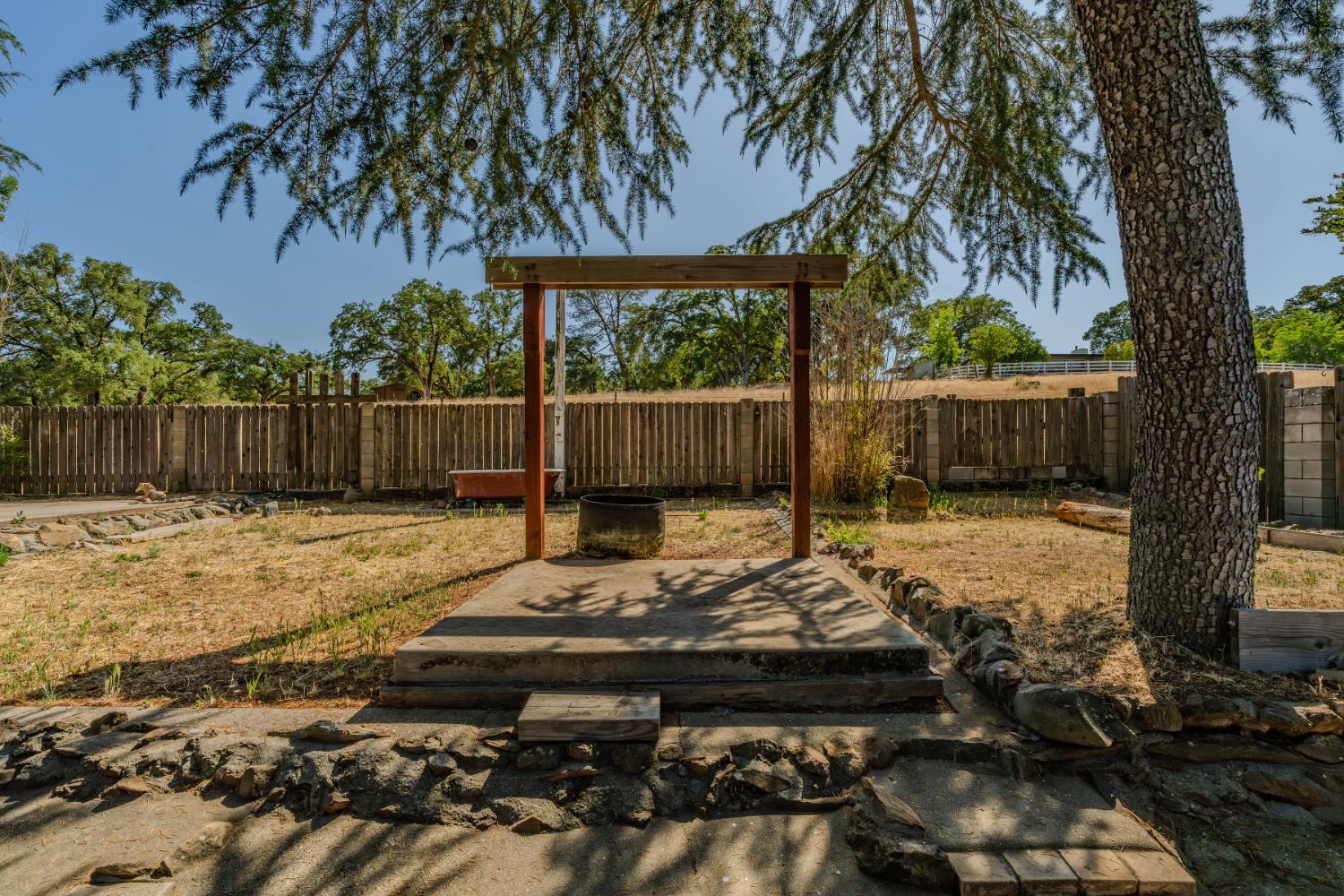 513 Perry Street Jackson, CA 95642 - Photo 47 of 56 a backyard of a house with lots of green space