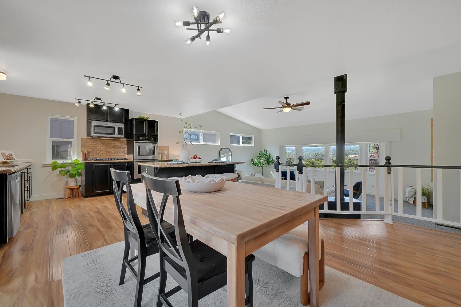 513 Perry Street Jackson, CA 95642 - Photo 6 of 56 a view of a dining room with furniture and wooden floor