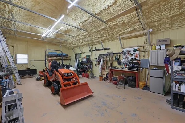 a view of a storage room with a lot of stuff and couches