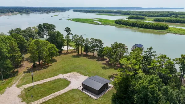 a view of a lake with a yard