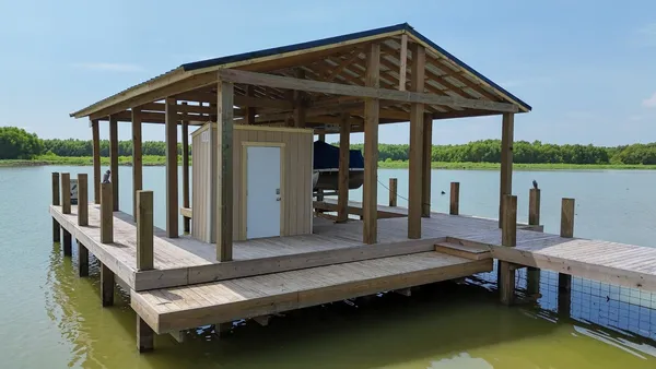 a small swimming pool view with a lake view