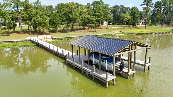 a view of a swimming pool with an outdoor space and seating area