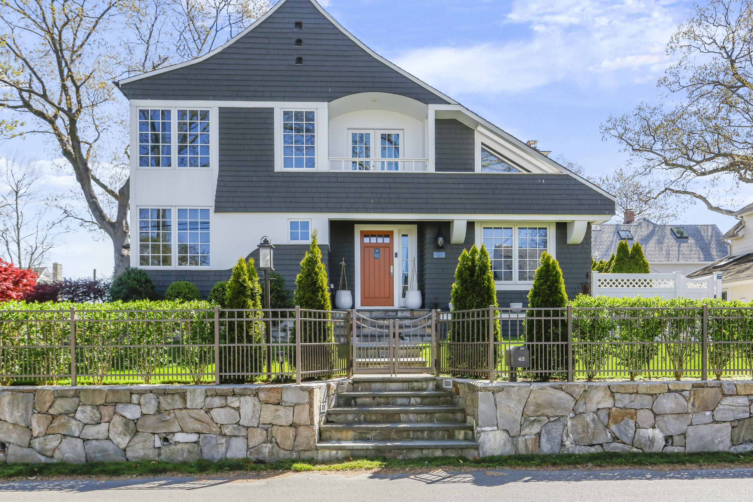 a front view of a house with garden