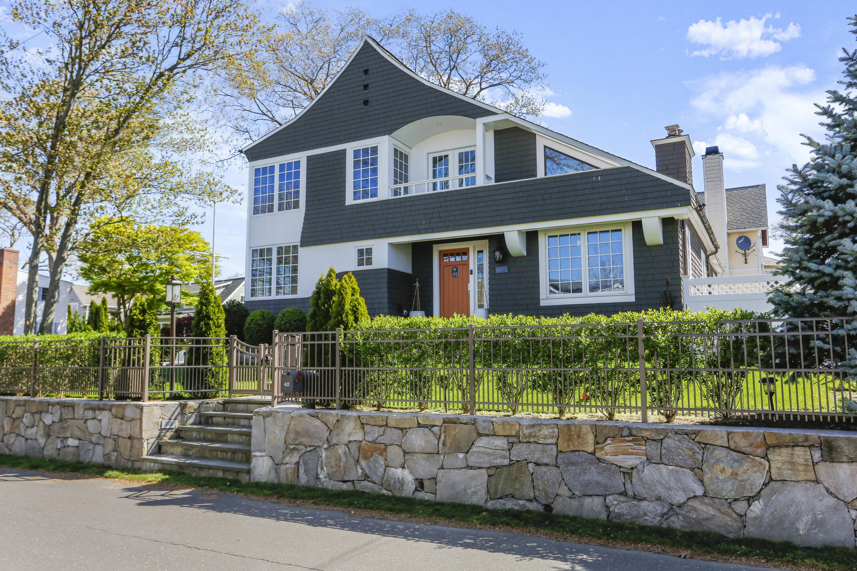 42 Pine Point Road Rowayton, CT 06853 - Photo 24 of 32 a front view of a house with a garden