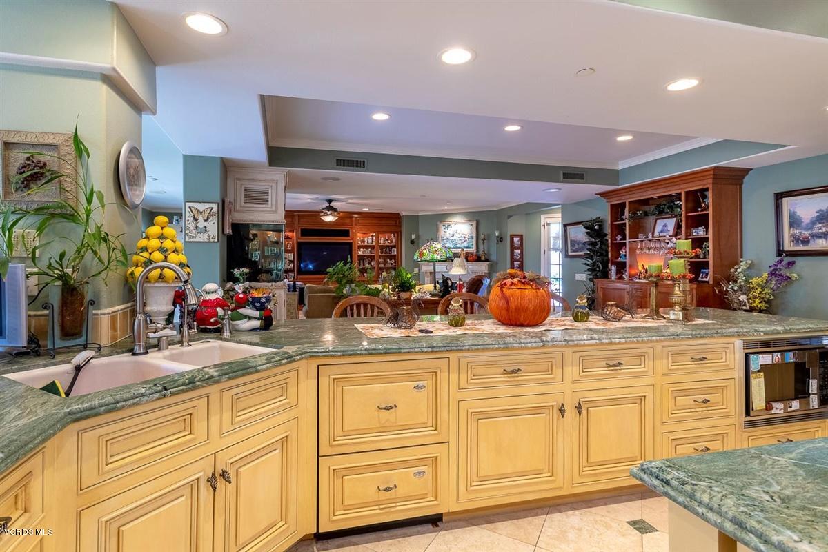 6933 Solano Verde Drive Somis, CA 93066 - Photo 14 of 58 a kitchen with stainless steel appliances granite countertop a sink and cabinets