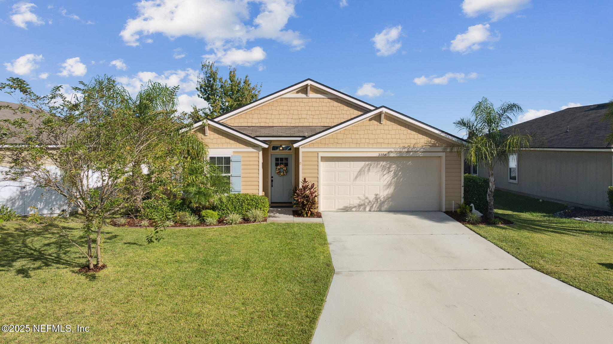 3356 Canyon Falls Drive Green Cove Springs, FL 32043 - Photo 1 of 66 a front view of a house with a yard and garage