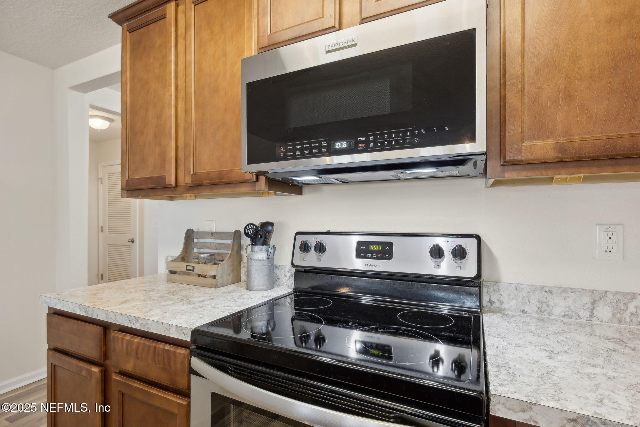 3356 Canyon Falls Drive Green Cove Springs, FL 32043 - Photo 12 of 66 a kitchen with a stove and a microwave