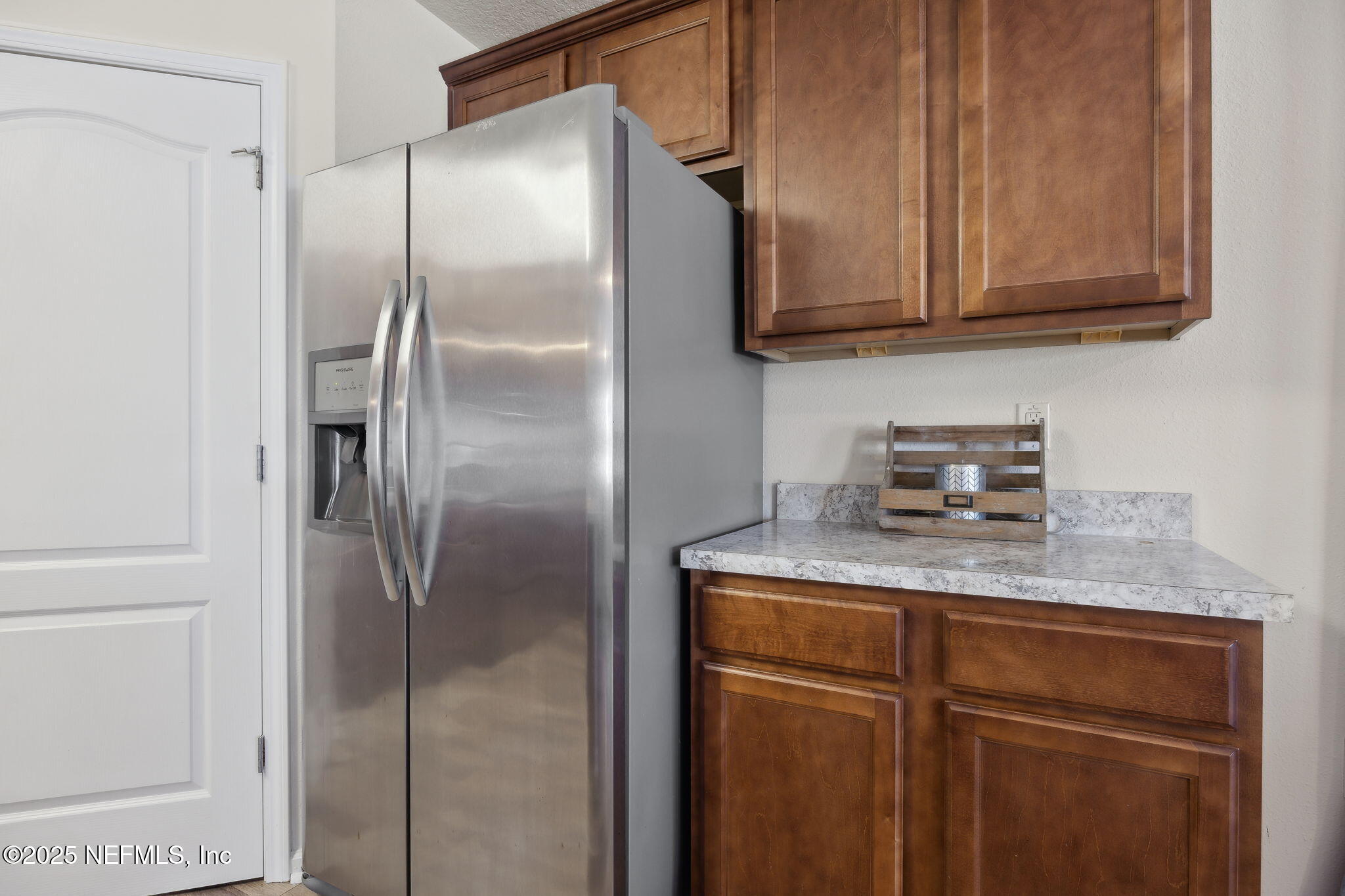 3356 Canyon Falls Drive Green Cove Springs, FL 32043 - Photo 14 of 66 a kitchen with stainless steel appliances granite countertop a refrigerator and a cabinets