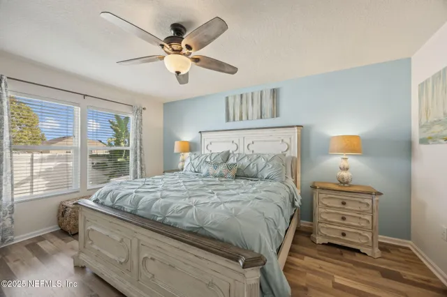 a bedroom with a bed and a lamp