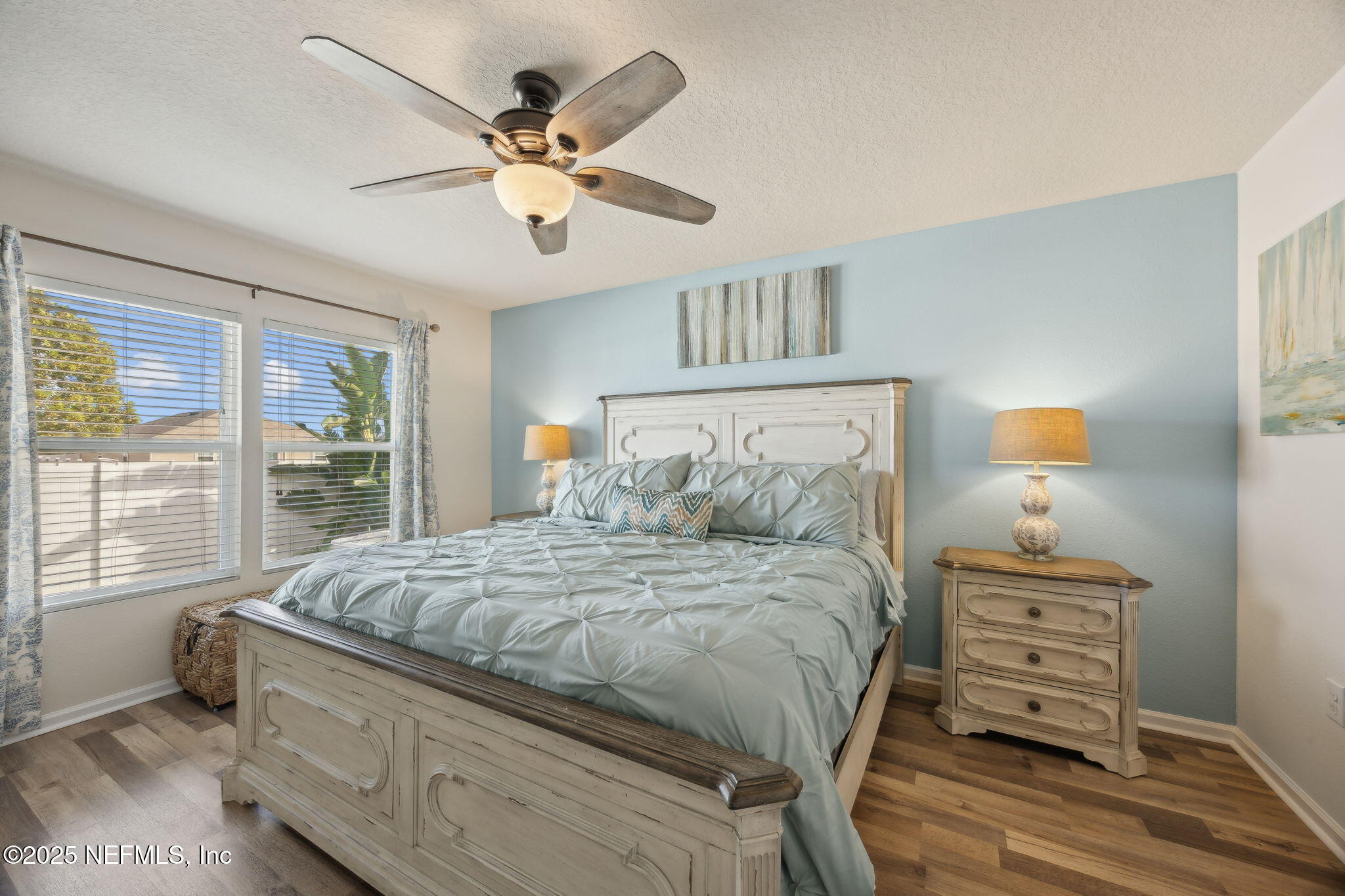 3356 Canyon Falls Drive Green Cove Springs, FL 32043 - Photo 16 of 66 a bedroom with a bed a chandelier and a window