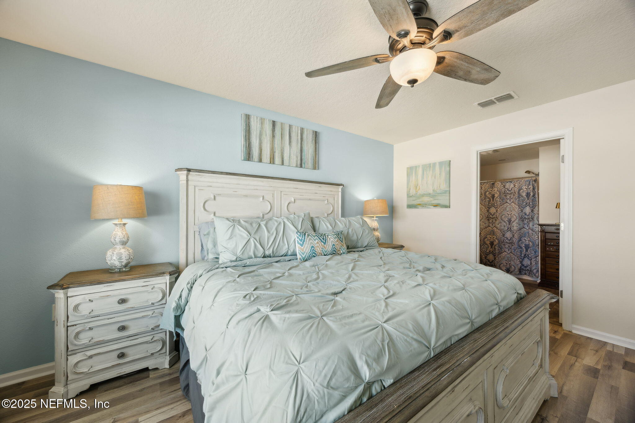 3356 Canyon Falls Drive Green Cove Springs, FL 32043 - Photo 17 of 66 a bedroom with a bed and a lamp