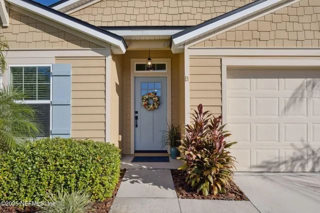 a potted plant sitting in front of a house