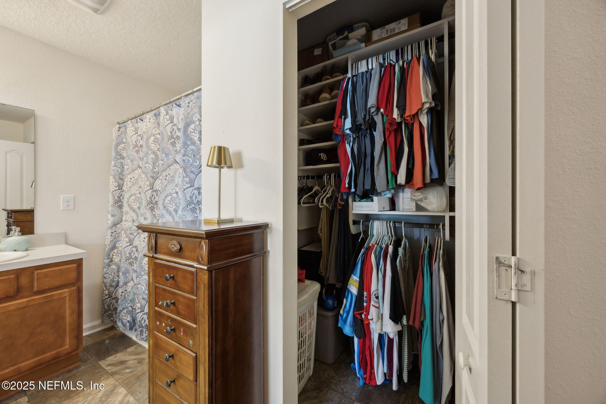 3356 Canyon Falls Drive Green Cove Springs, FL 32043 - Photo 21 of 66 a view of walk in closet with clothes
