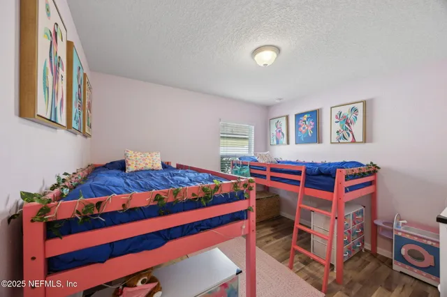 a view of a livingroom with furniture and workspace