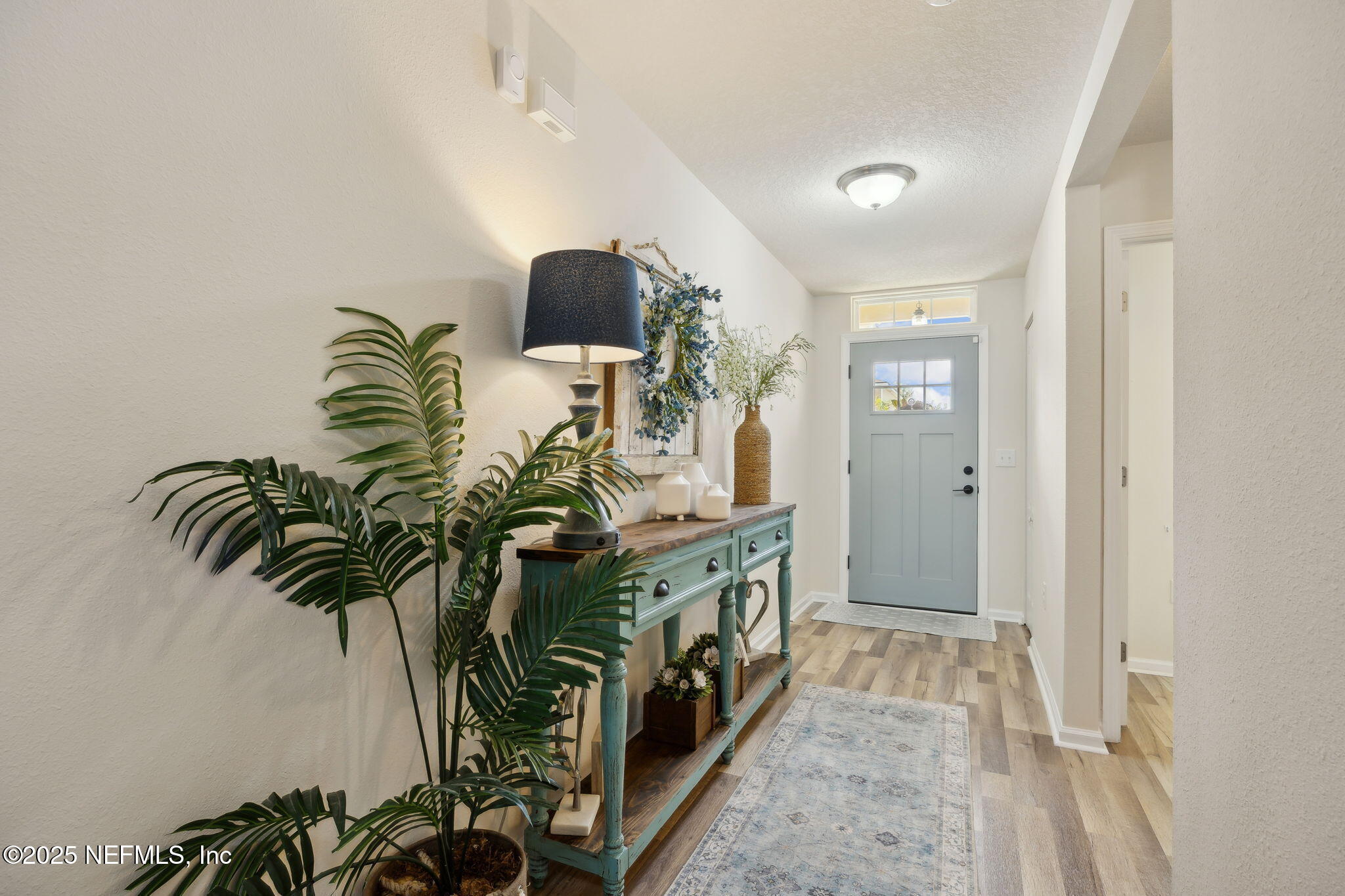 3356 Canyon Falls Drive Green Cove Springs, FL 32043 - Photo 4 of 66 a view of entryway and hall with wooden floor