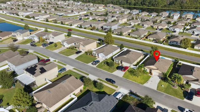 a view of a garden with a building in the background