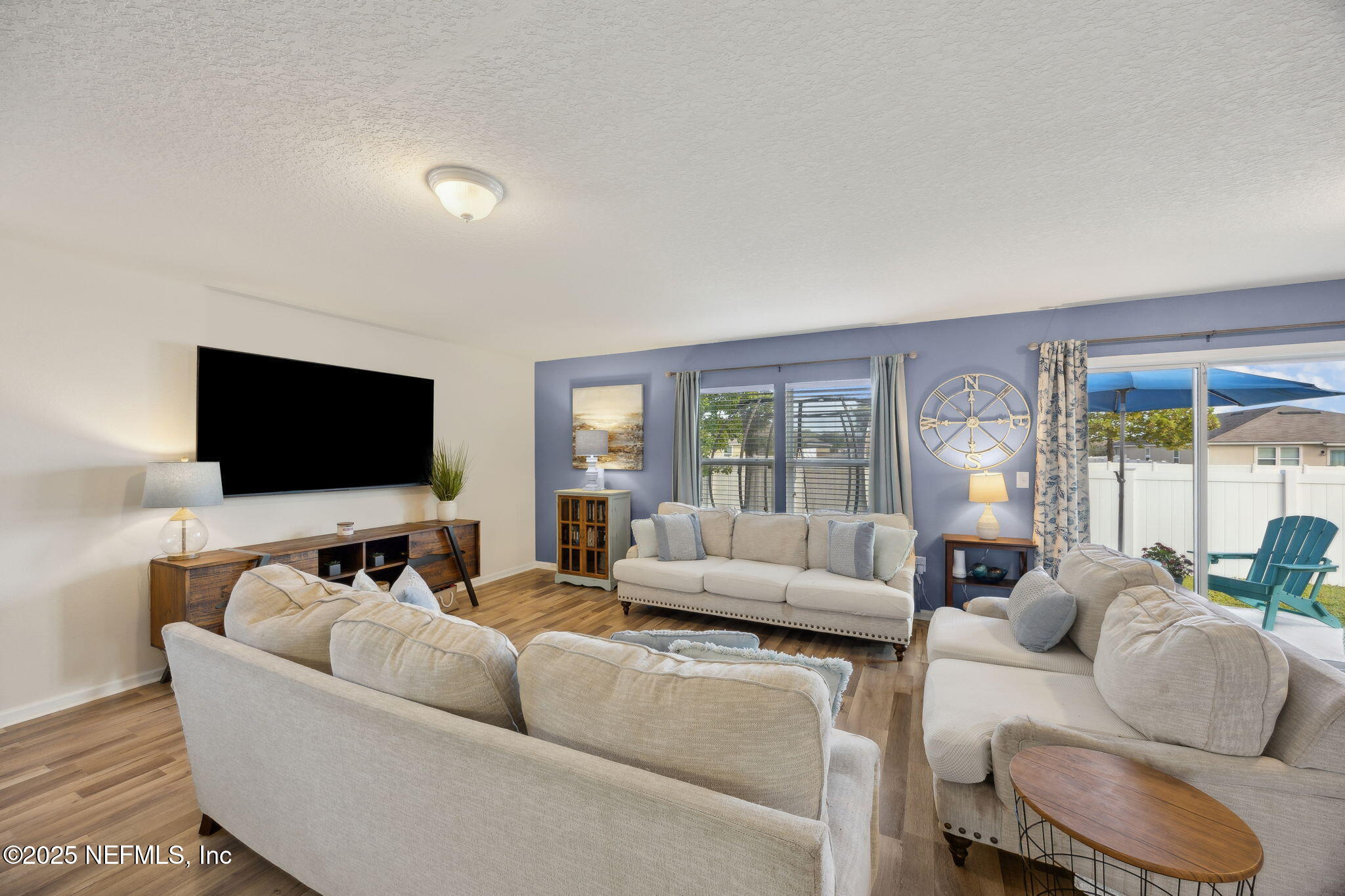 3356 Canyon Falls Drive Green Cove Springs, FL 32043 - Photo 5 of 66 a living room with furniture and a flat screen tv