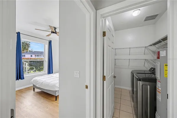 a bedroom with furniture and a window