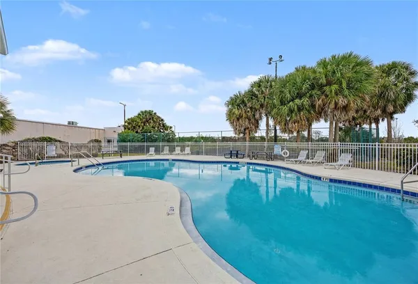 a view of a swimming pool with a lake view