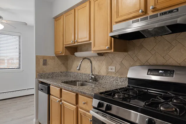 a kitchen with a stove and a sink