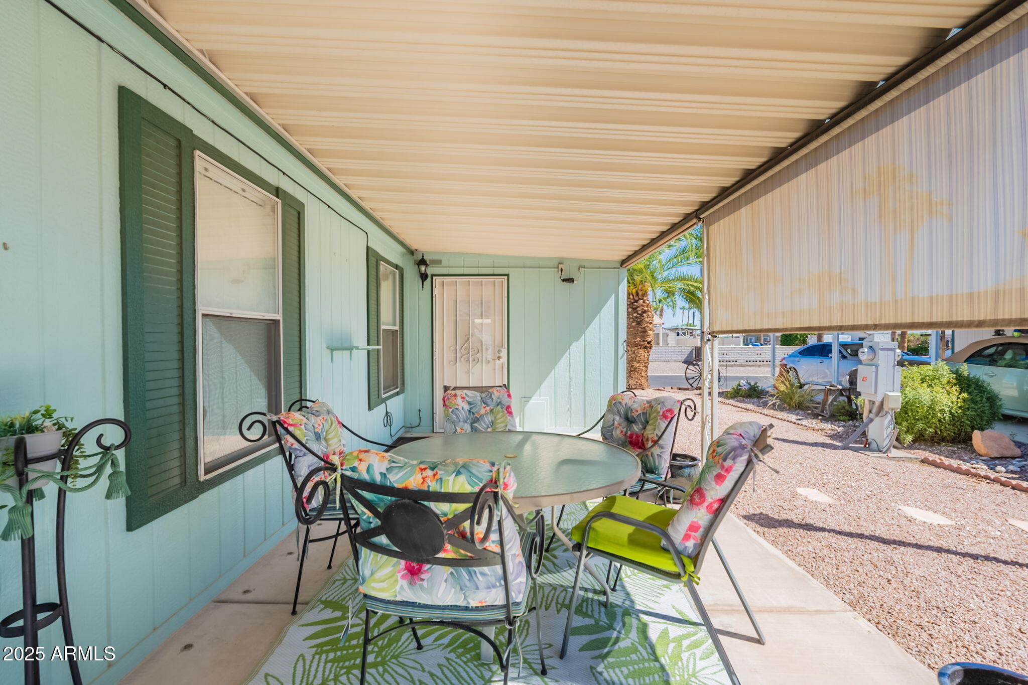3700 South Tomahawk Road, Unit 39 Apache Junction, AZ 85119 - Photo 38 of 53 a patio with patio table and chairs