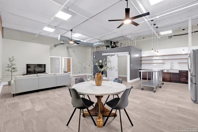 a dining room with furniture and window