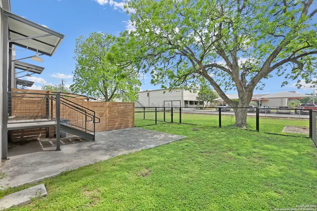 a view of backyard with green space