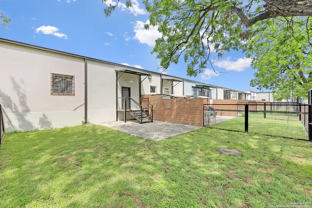 a view of a backyard with a garden and plants
