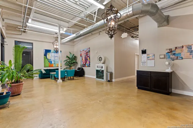 a view of a livingroom with furniture and furniture