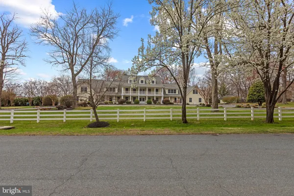 a view of green field with trees around