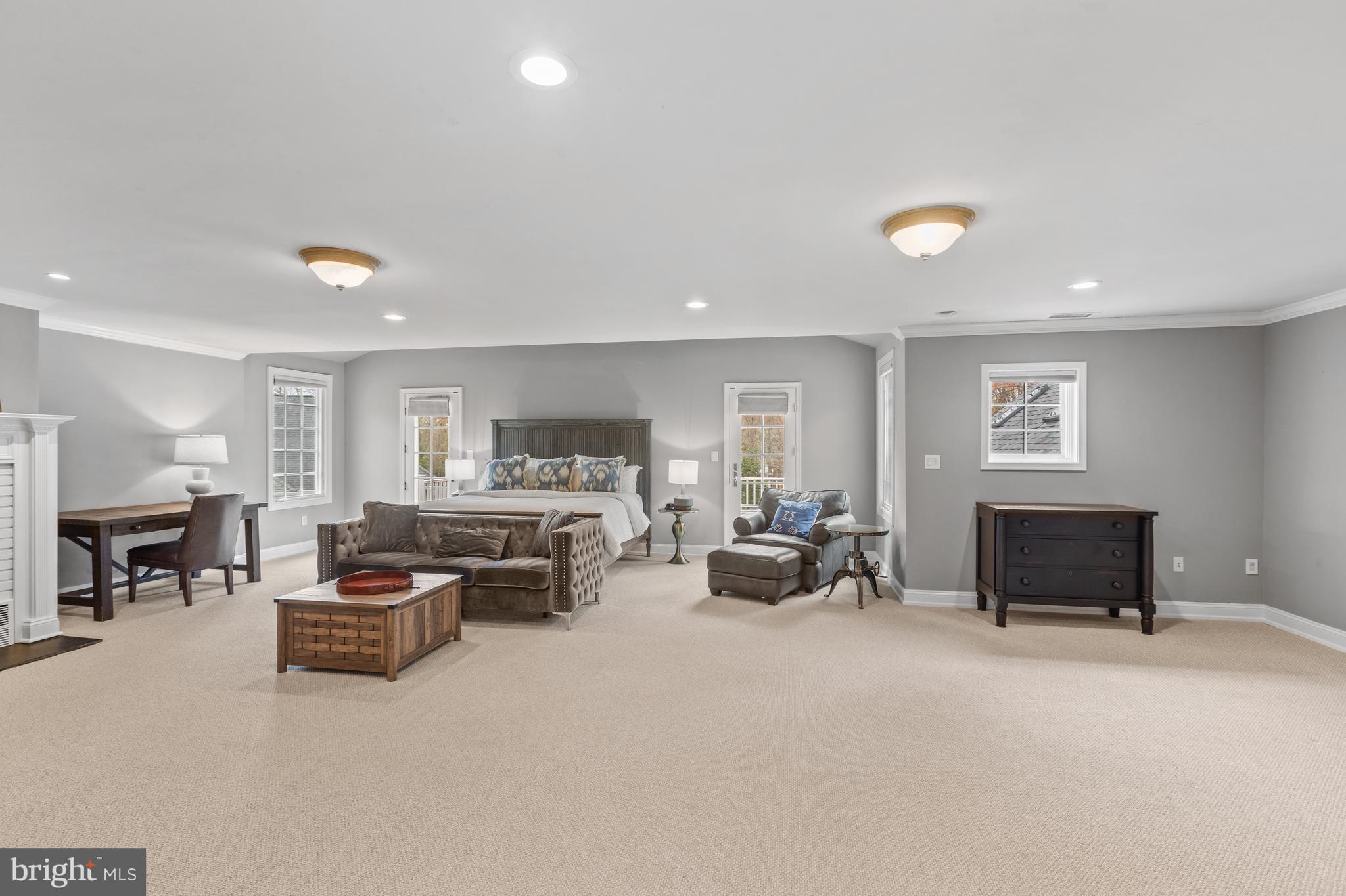 3054 Rundelac Road Annapolis, MD 21403 - Photo 26 of 49 a living room with furniture a fireplace and a flat screen tv