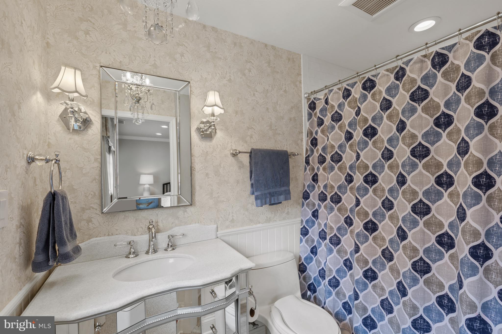 3054 Rundelac Road Annapolis, MD 21403 - Photo 33 of 49 a bathroom with a sink toilet and a mirror