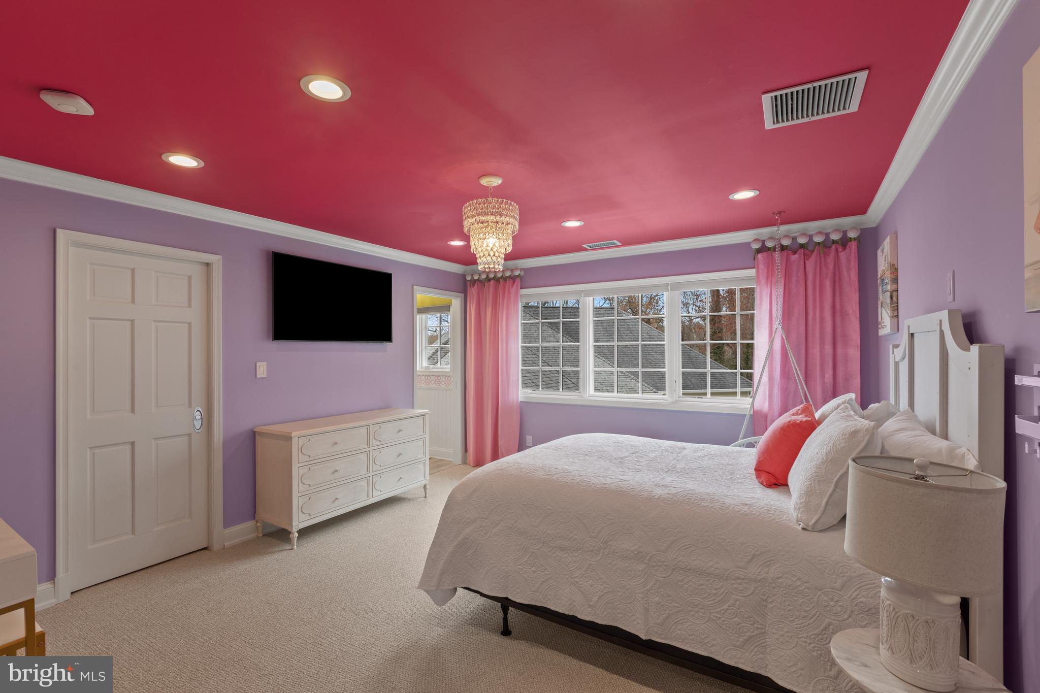 3054 Rundelac Road Annapolis, MD 21403 - Photo 34 of 49 a bedroom with a bed and a flat screen tv