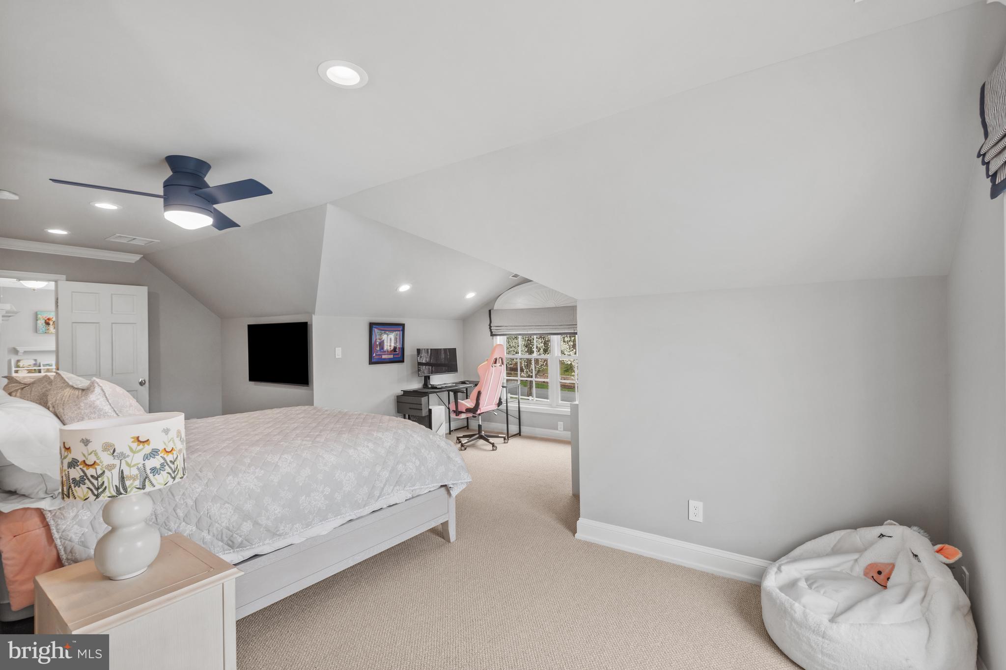 3054 Rundelac Road Annapolis, MD 21403 - Photo 36 of 49 a bedroom with a bed and a chandelier