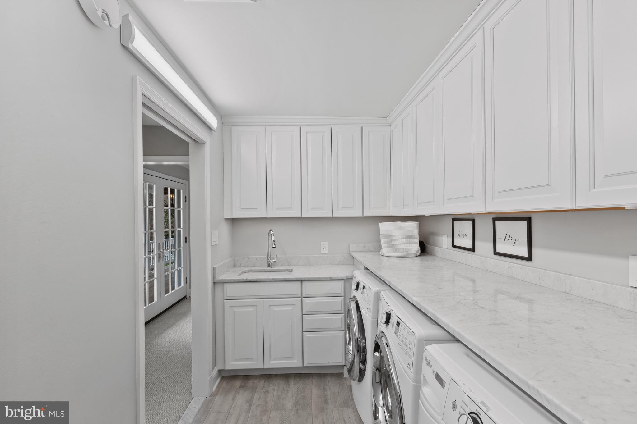 3054 Rundelac Road Annapolis, MD 21403 - Photo 38 of 49 a kitchen with cabinets appliances and a sink