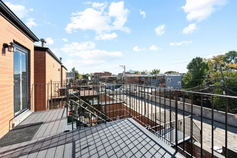 a view of a balcony with furniture