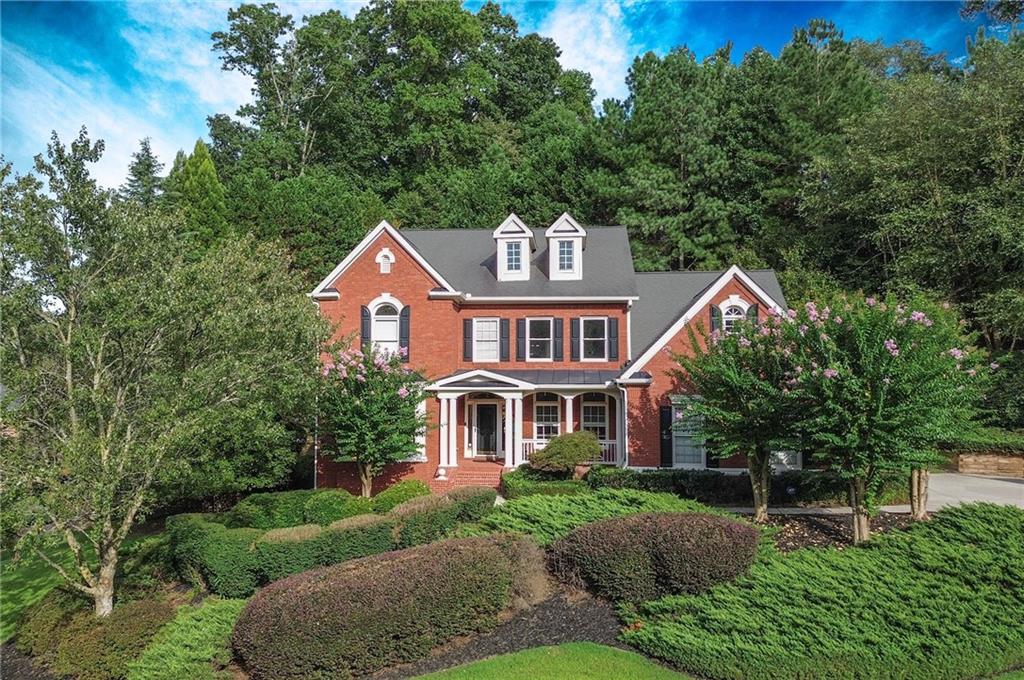 a front view of a house with a yard