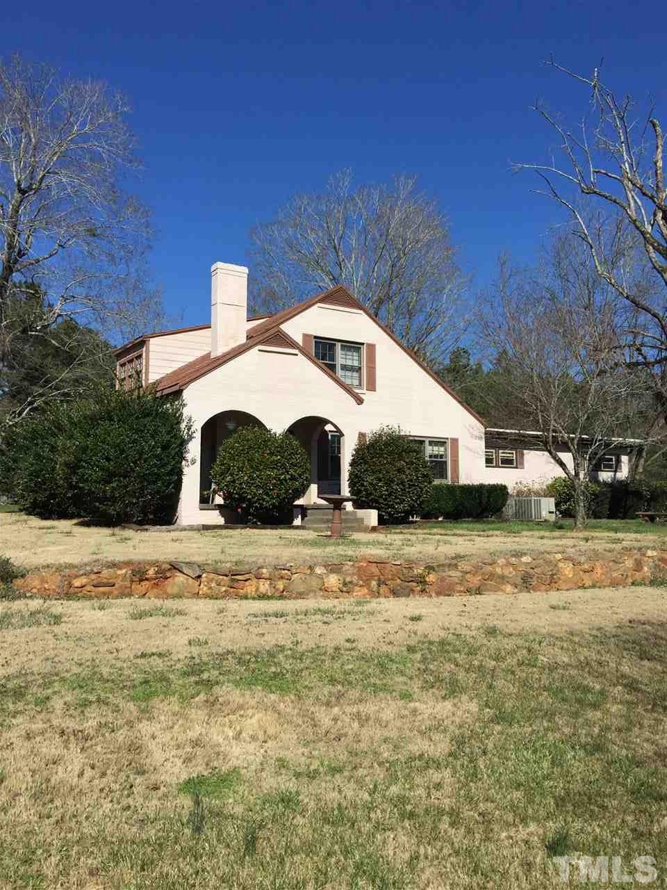 9804 Ray Road Raleigh, NC 27613 - Photo 1 of 8 a front view of a house with a yard
