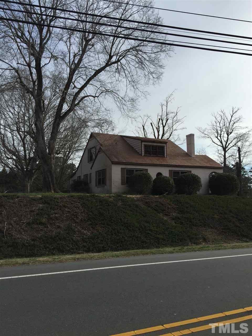 9804 Ray Road Raleigh, NC 27613 - Photo 4 of 8 a view of a house with a yard