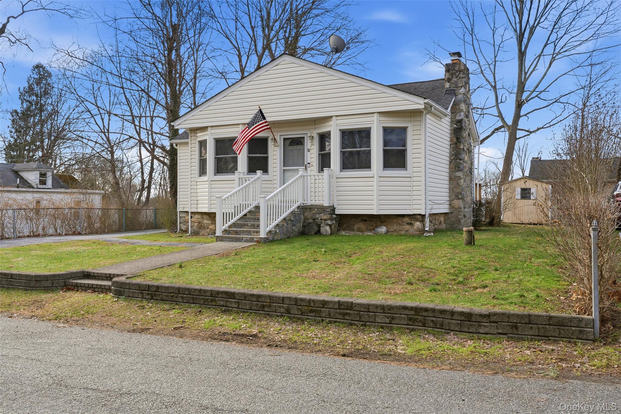 51 Johnson Street Lake Peekskill, NY 10537 - Photo 2 of 29 a view of a house with a yard