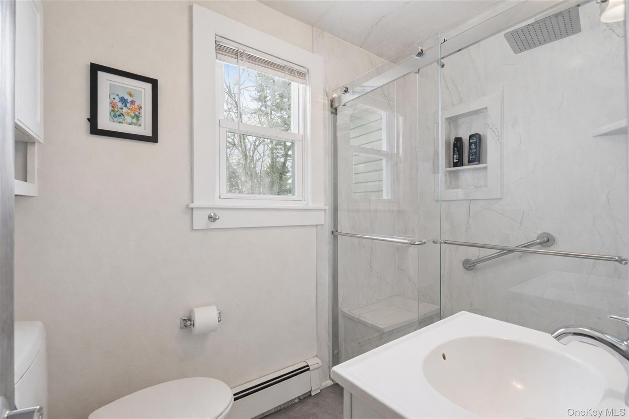 51 Johnson Street Lake Peekskill, NY 10537 - Photo 23 of 29 a bathroom with a sink and mirror with toilet