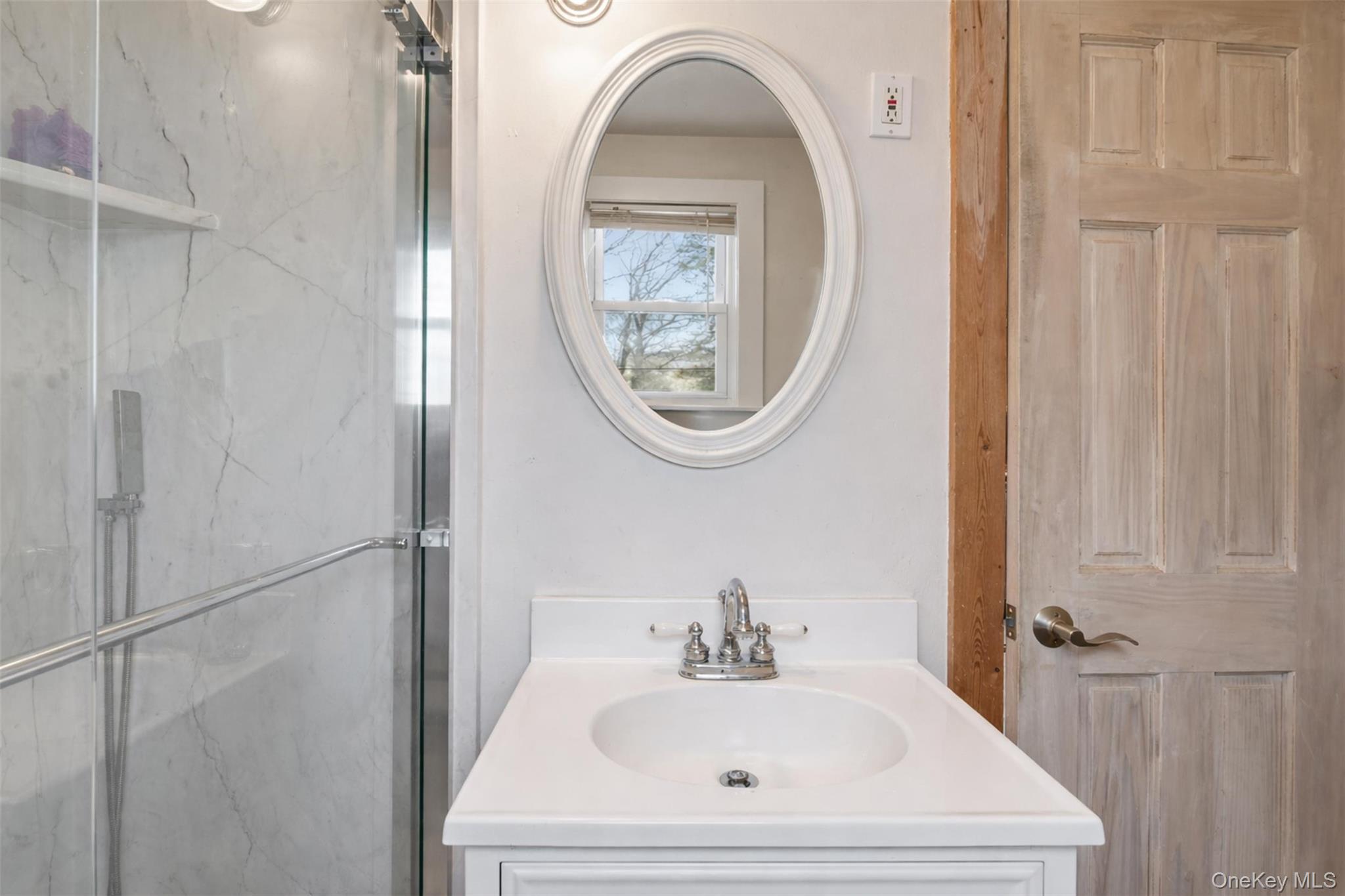 51 Johnson Street Lake Peekskill, NY 10537 - Photo 24 of 29 a bathroom with a sink and a mirror