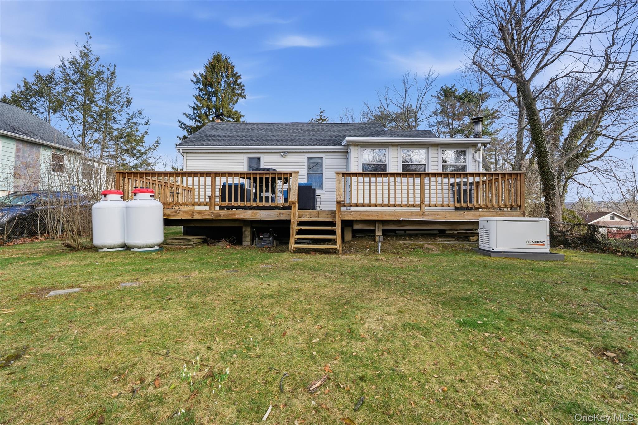 51 Johnson Street Lake Peekskill, NY 10537 - Photo 28 of 29 a view of a house with a backyard and a garden