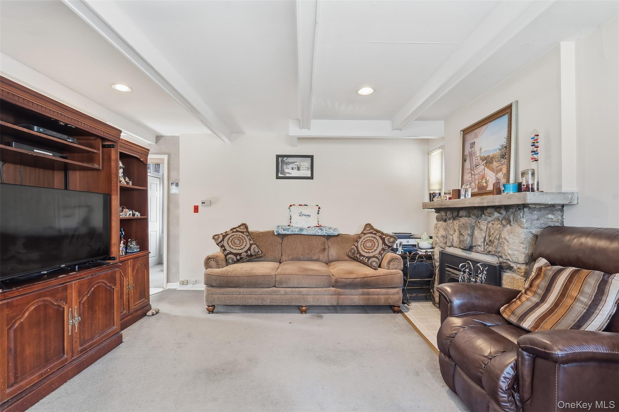 51 Johnson Street Lake Peekskill, NY 10537 - Photo 5 of 29 a living room with furniture and a flat screen tv