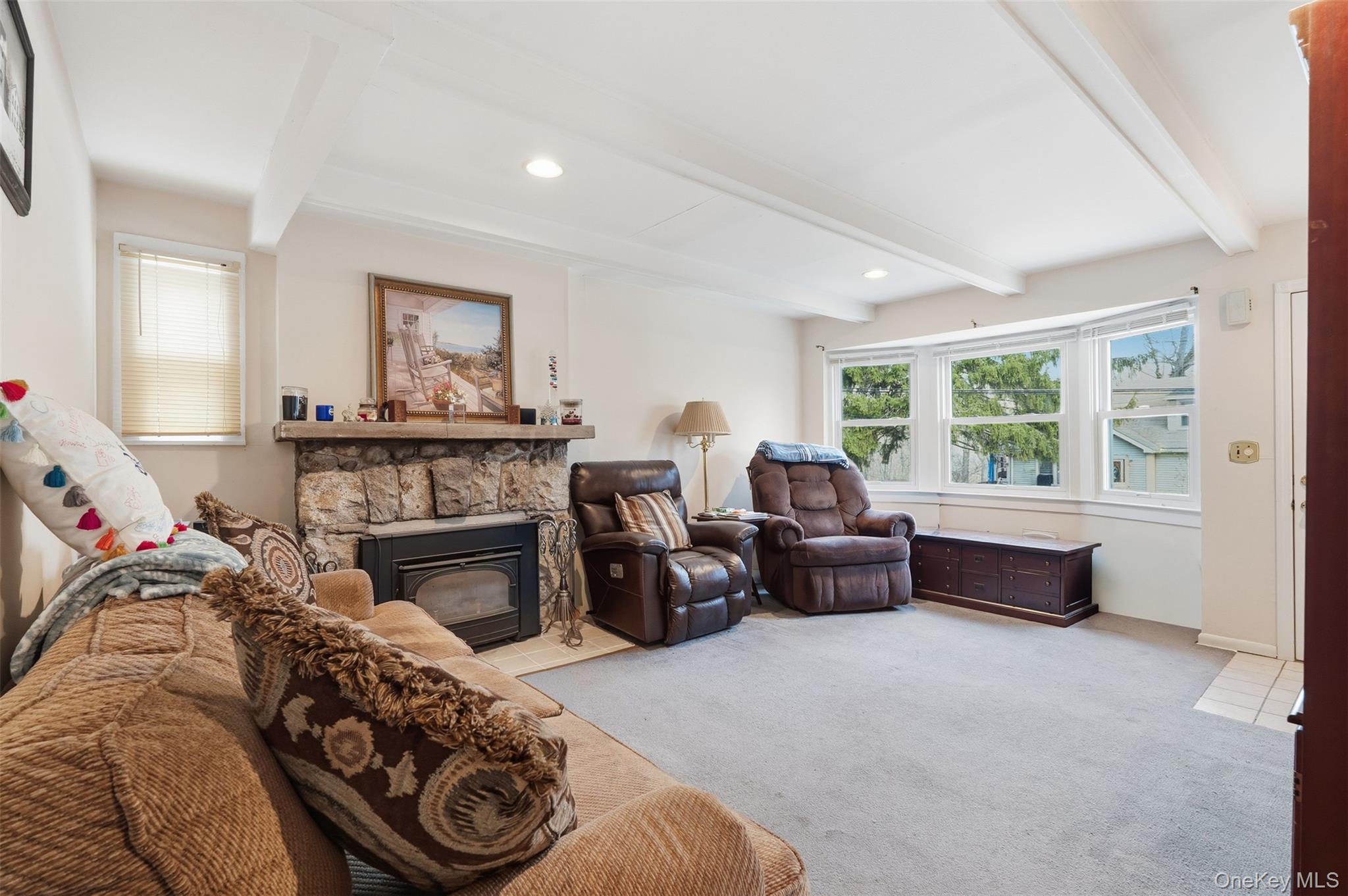 51 Johnson Street Lake Peekskill, NY 10537 - Photo 7 of 29 a living room with furniture and a fireplace